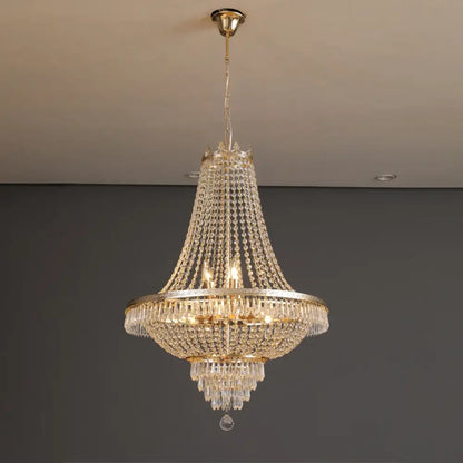 DecorBites crystal chandelier with gold-toned metal frame and cascading clear crystals for luxury living spaces