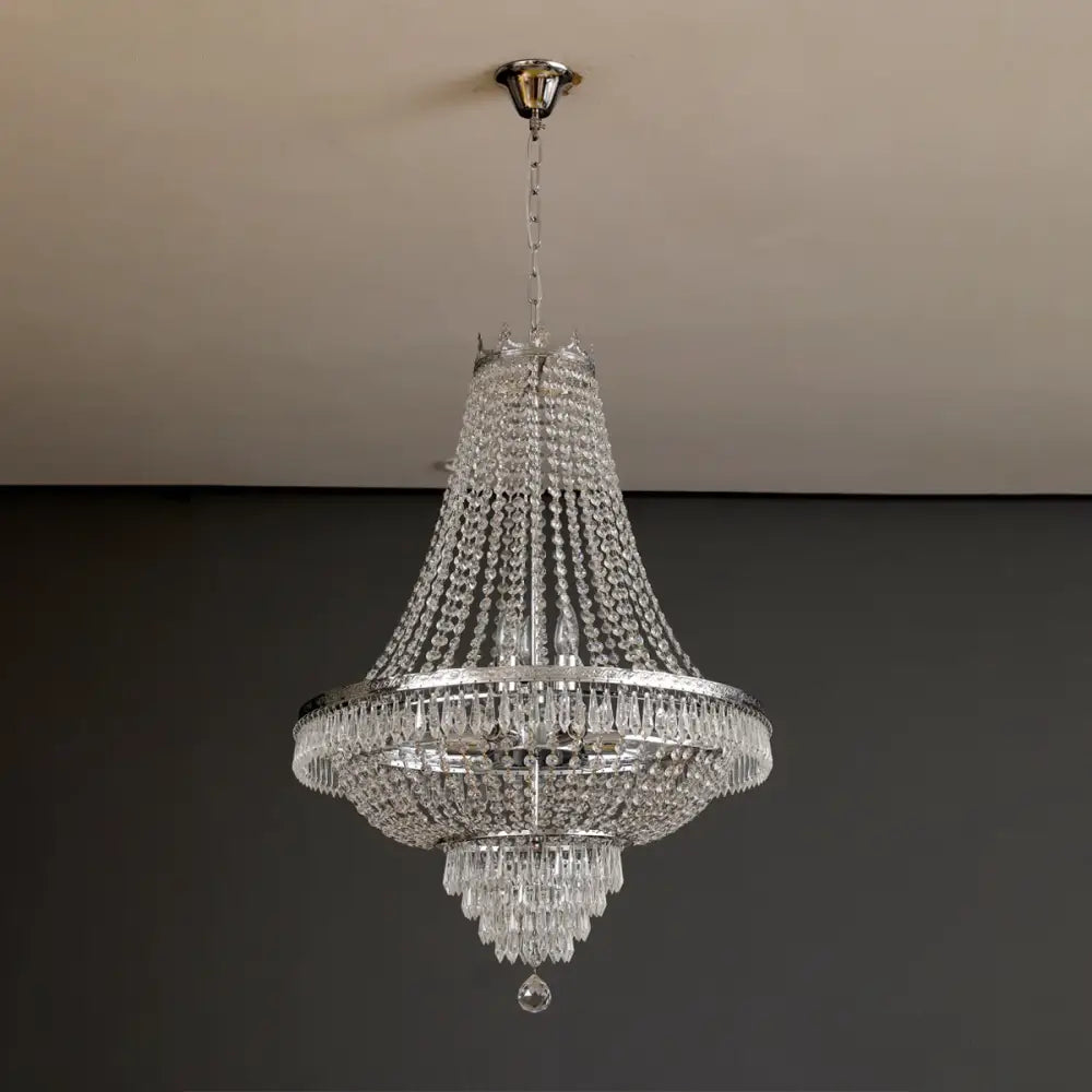 Elegant mult-tiered decorbites crystal chandelier with polished chrome finish and cascading clear crystals for luxury lighting