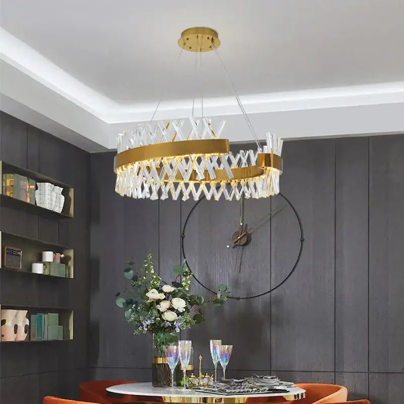 Gold-toned decorbites crystal chandelier with geometric lattice design and clear crystal accents for luxury lighting