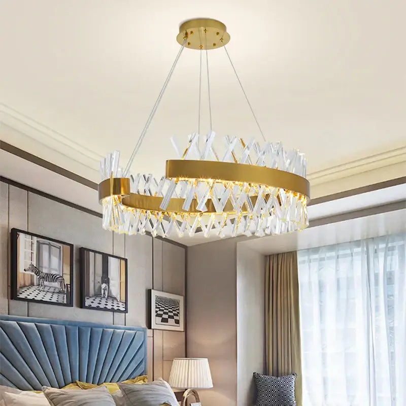 A modern decorbites crystal chandelier with gold-toned metal frame and clear crystal accents for luxury lighting