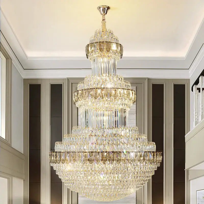 A decorbites crystal chandelier with a gold-toned metal frame and clear crystals for luxury lighting in villas and hotels