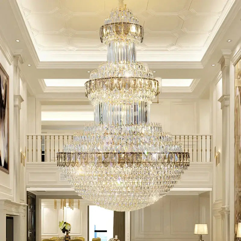 A decorbites crystal chandelier with gold-toned metal and cascading clear crystals for luxury lighting in villas hotels and offices