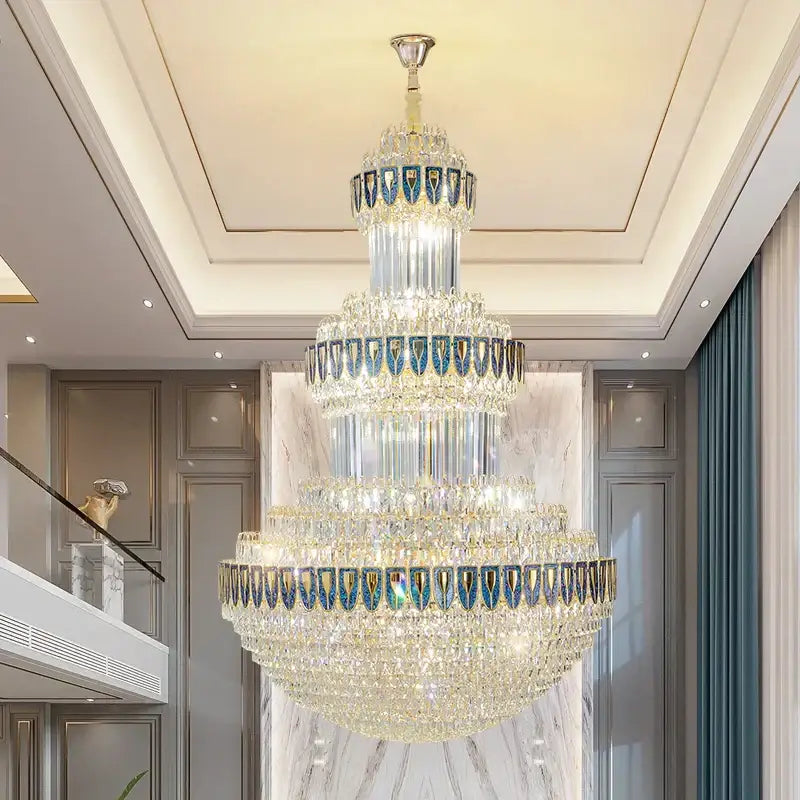 A decorbites crystal chandelier with cascading clear and blue glass elements for luxury villa hotel office lighting