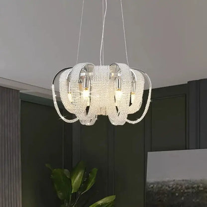 Decorbites crystal chandelier with sleek circular design featuring clear faceted crystals and chrome metal arms for luxury living spaces