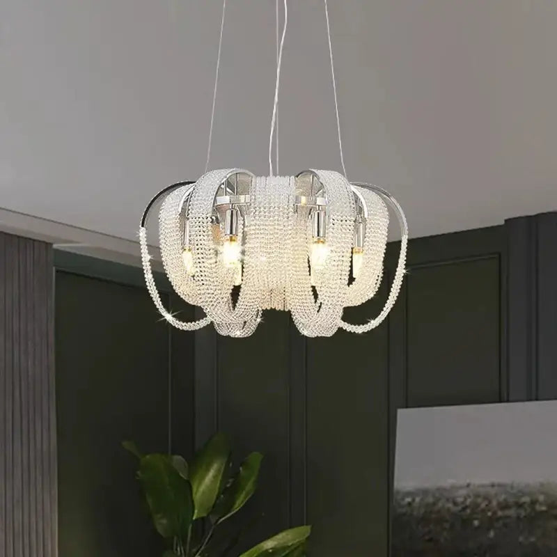 Decorbites crystal chandelier with sleek circular design featuring clear faceted crystals and chrome metal arms for luxury living spaces