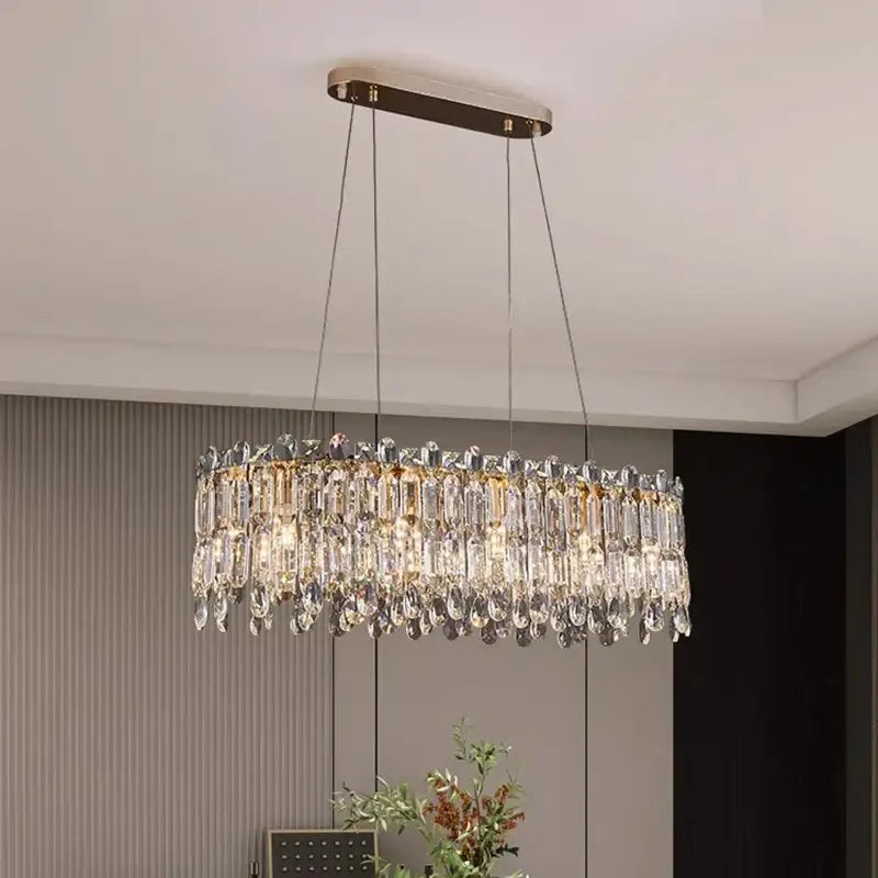 Elegant oval-shaped decorbites crystal chandelier with gold-toned metal frame and hanging chains for luxury living rooms