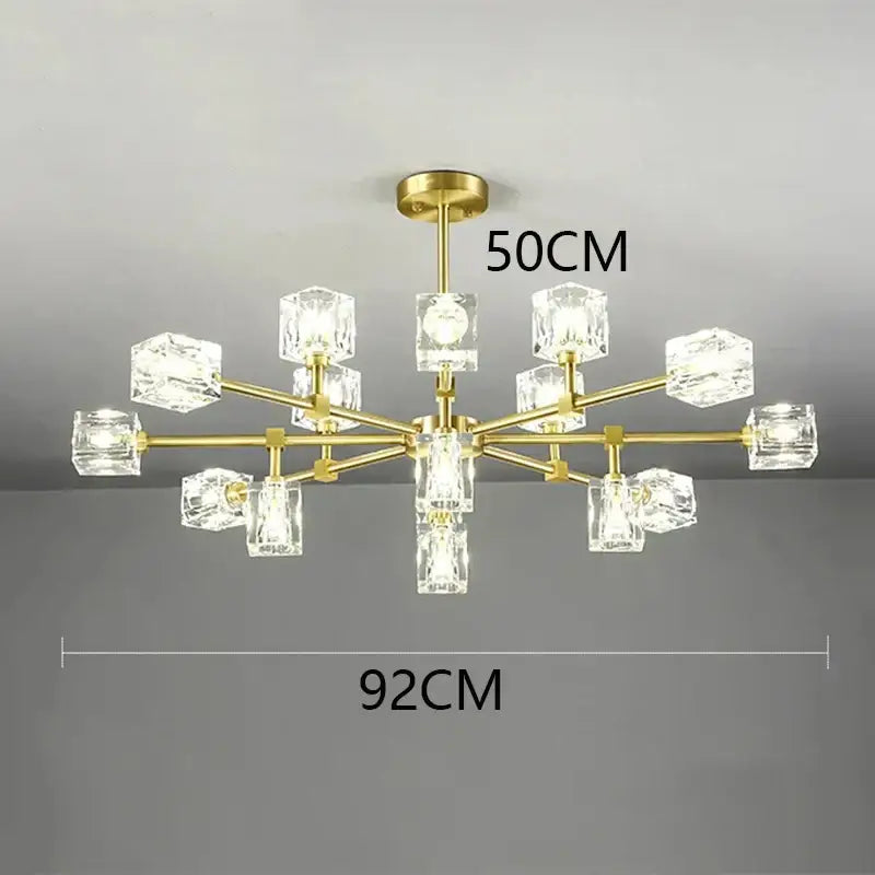 Gold-toned decorbites crystal chandelier with clear crystal cube shades for luxury living room and bedroom lighting
