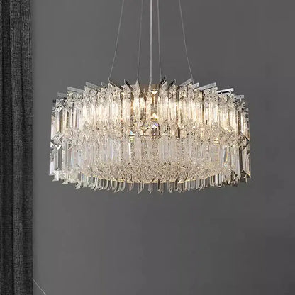 A modern multi-tiered decorbites crystal chandelier with clear glass rods and dangling crystals for luxury rooms