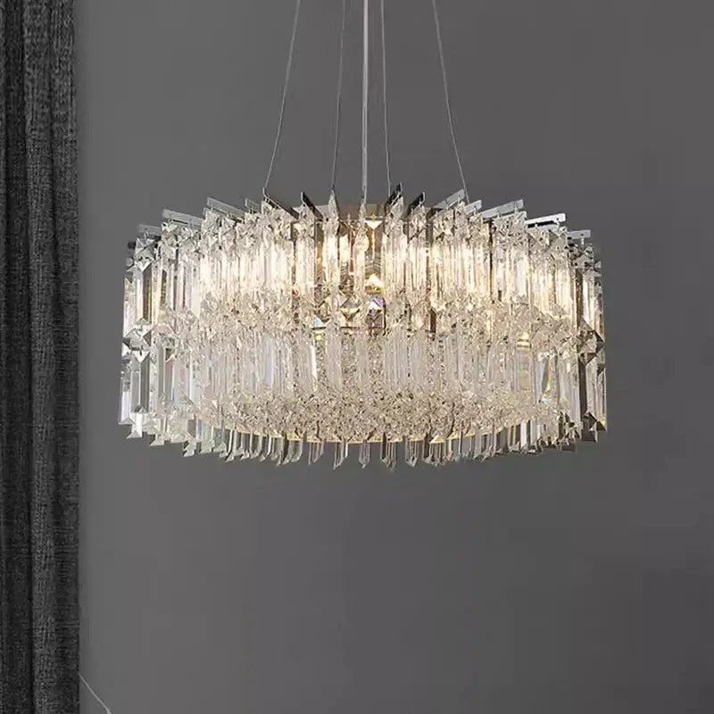 A modern multi-tiered decorbites crystal chandelier with clear glass rods and dangling crystals for luxury rooms