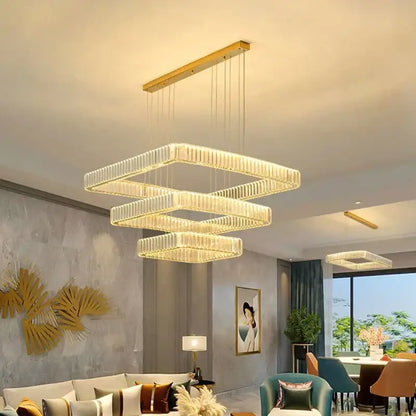 Modern gold-toned decorbites crystal chandelier with layered illuminated crystal panels for luxury living room lighting