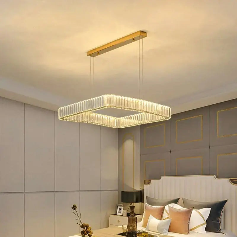 Gold-finished decorbites crystal chandelier with geometric design and clear panels for luxury living room and bedroom lighting