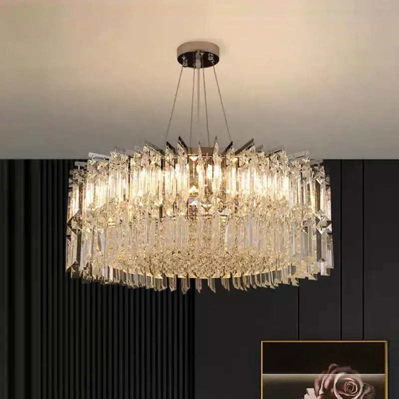 Decorbites crystal chandelier with cascading clear glass prisms and sleek metallic frame for luxury living room lighting