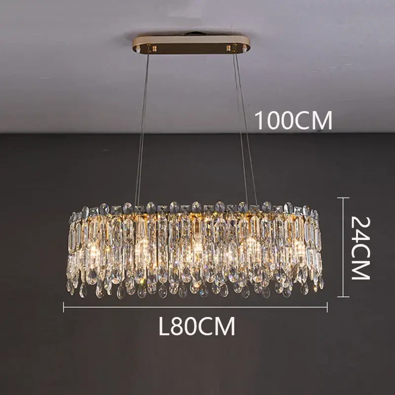 A luxurious gold-toned decorbites crystal chandelier with cascading clear prisms for living room and bedroom lighting