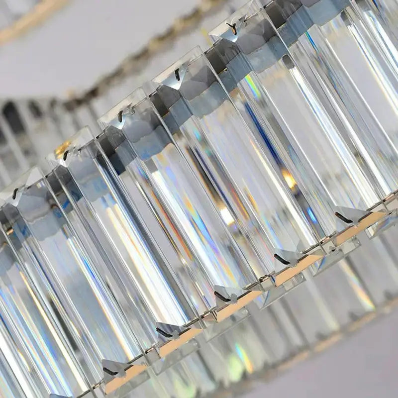 Clear faceted crystal prisms arranged in a sleek linear design of decorbites crystal chandelier for luxury spaces