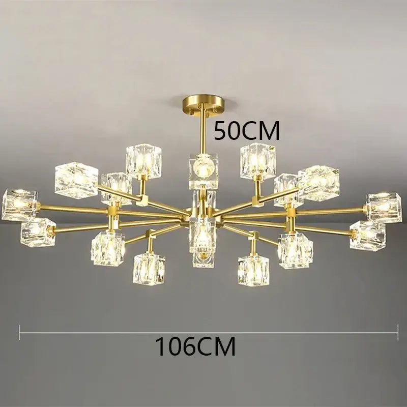 Gold-toned decorbites crystal chandelier with clear crystal cube shades in a modern branching design for luxury spaces