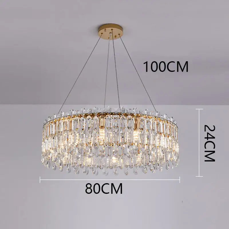 A luxurious gold-toned decorbites crystal chandelier with clear prism tiers and teardrop crystals for elegant living spaces