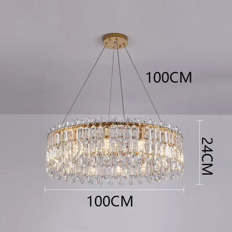 A luxurious gold-toned decorbites crystal chandelier with cascading clear prisms and teardrop crystals for elegant lighting