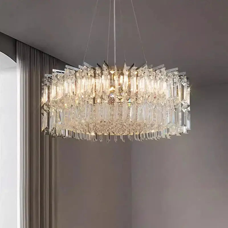 Decorbites crystal chandelier with multi-tiered clear glass prisms and sleek metallic frame for luxury living spaces