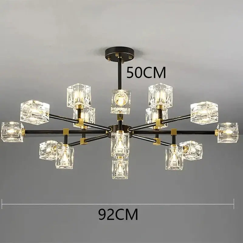 Modern decorbites crystal chandelier with black metal arms gold accents and clear crystal cube shades for luxury spaces