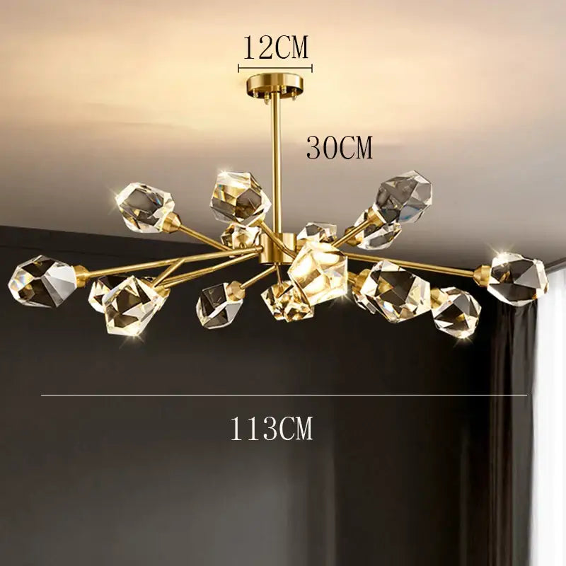Gold-toned decorbites crystal chandelier with multiple faceted crystal orbs for luxury living and dining rooms