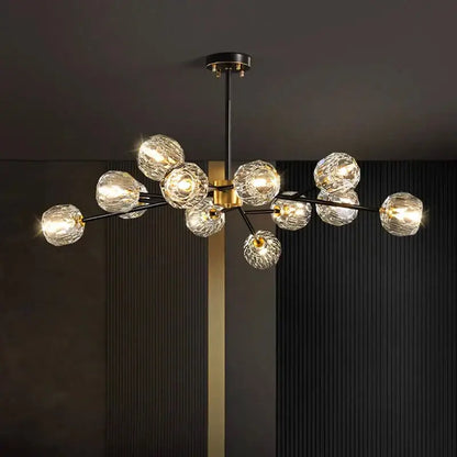Modern decorbites crystal chandelier with black metal arms gold accents and faceted crystal globe shades for living room lighting