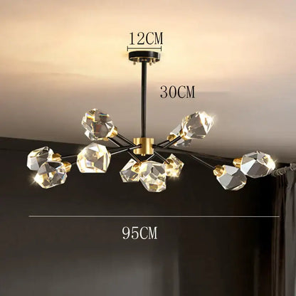 Modern decorbites crystal chandelier with black and gold accents and faceted clear glass orbs for luxury living spaces