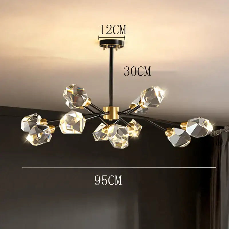 Modern decorbites crystal chandelier with black and gold accents and faceted clear glass orbs for luxury living spaces