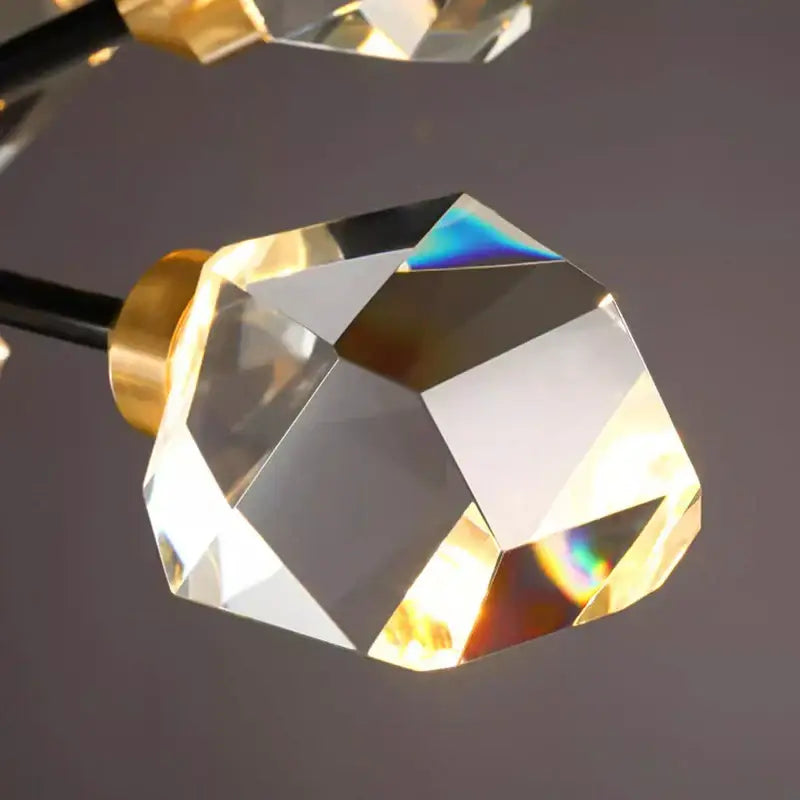 Clear faceted crystal knob with polished gold toned base on decorbites crystal chandelier for luxury living room lighting