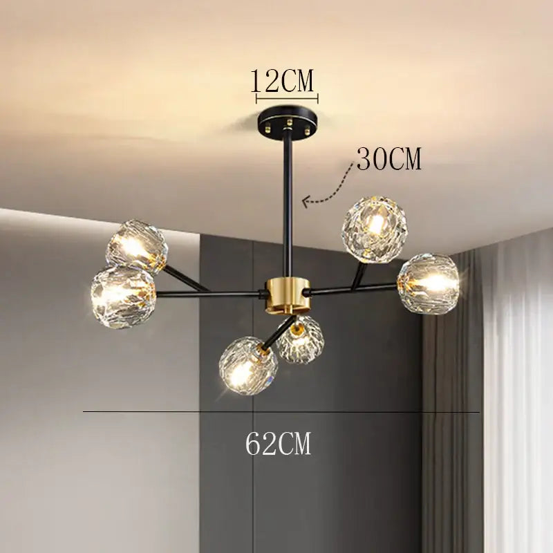 Modern black and gold decorbites crystal chandelier with five faceted crystal globe lights for luxury living rooms and dining rooms