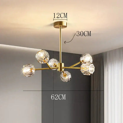 Gold-toned DecorBites crystal chandelier with six faceted crystal globe lights for luxury living and dining rooms