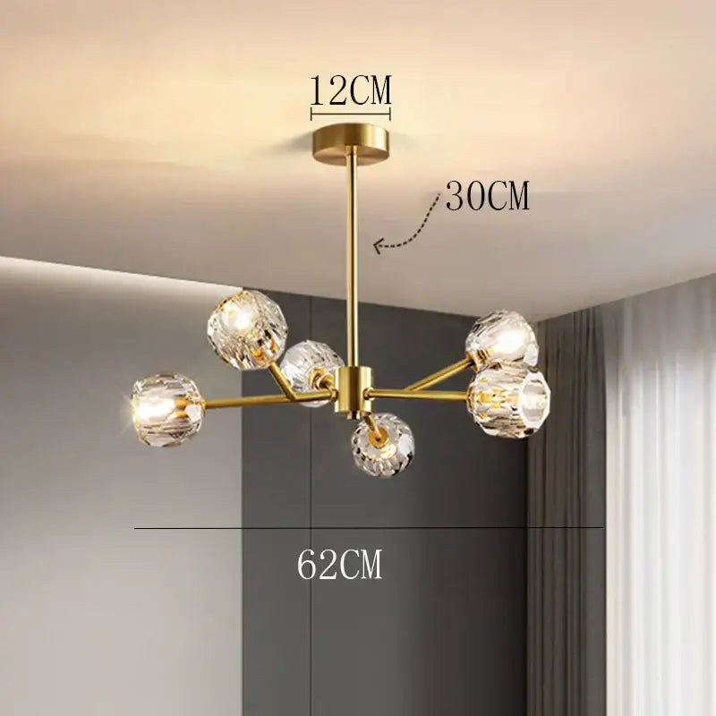 Gold-toned DecorBites crystal chandelier with six faceted crystal globe lights for luxury living and dining rooms