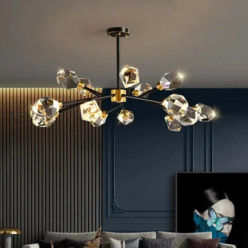 Modern decorbites crystal chandelier with black and gold metal arms featuring faceted crystal pendants for luxury living rooms