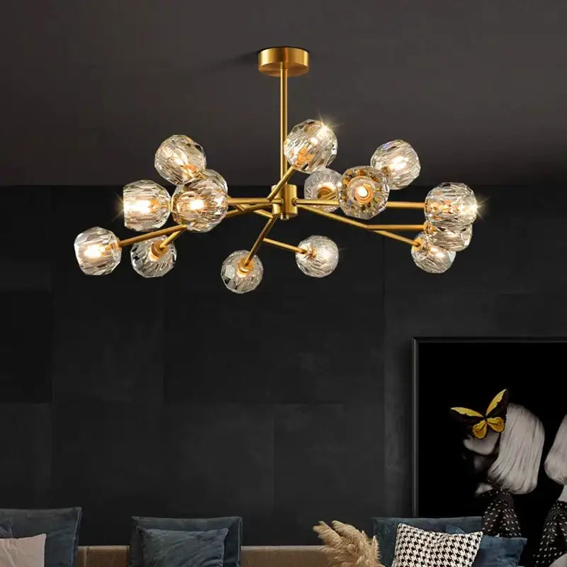 Gold-toned decorbites crystal chandelier with faceted crystal globe bulbs for luxury living and dining rooms ceiling light