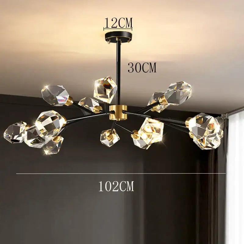 A decorbites crystal chandelier with black metal frame gold accents and faceted crystal spheres for luxury living rooms