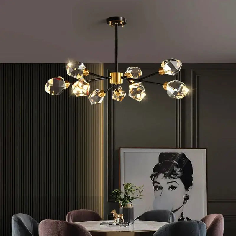 A decorbites crystal chandelier with black rod gold accents and faceted crystal bulbs for luxury living rooms
