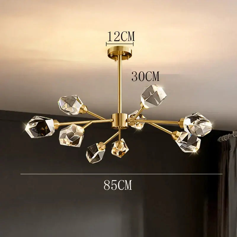 Gold-toned decorbites crystal chandelier with eight faceted crystal bulbs for luxury living room and dining ceiling light