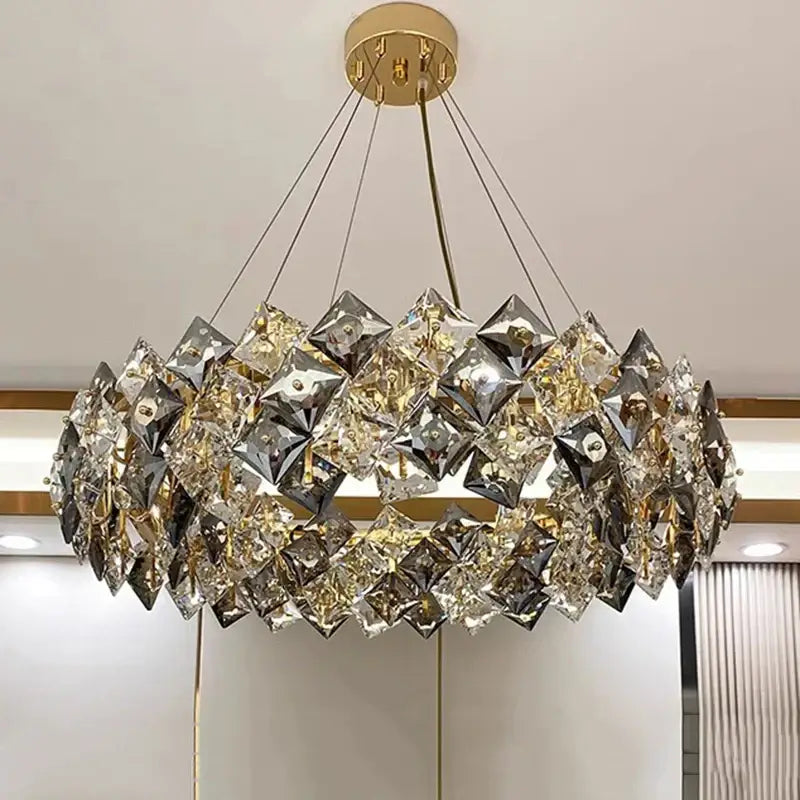 Luxurious gold-toned decorbites crystal chandelier with circular faceted prisms for modern living room lighting