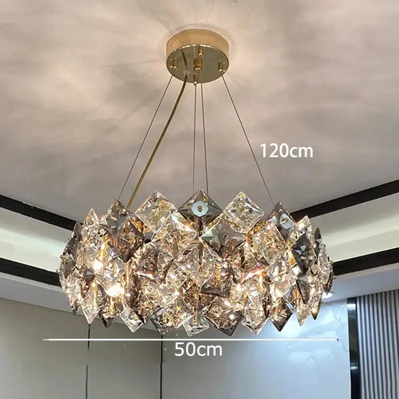 A decorbites crystal chandelier with 120cm diameter clear faceted crystals and gold ceiling mount for luxury living spaces