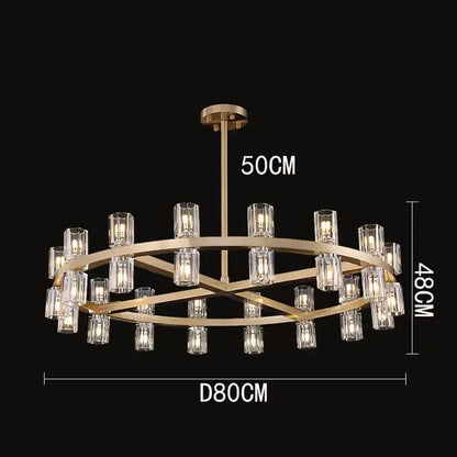 Gold-toned decorbites crystal chandelier with multiple tiers of clear glass candle-style bulbs for luxury living rooms
