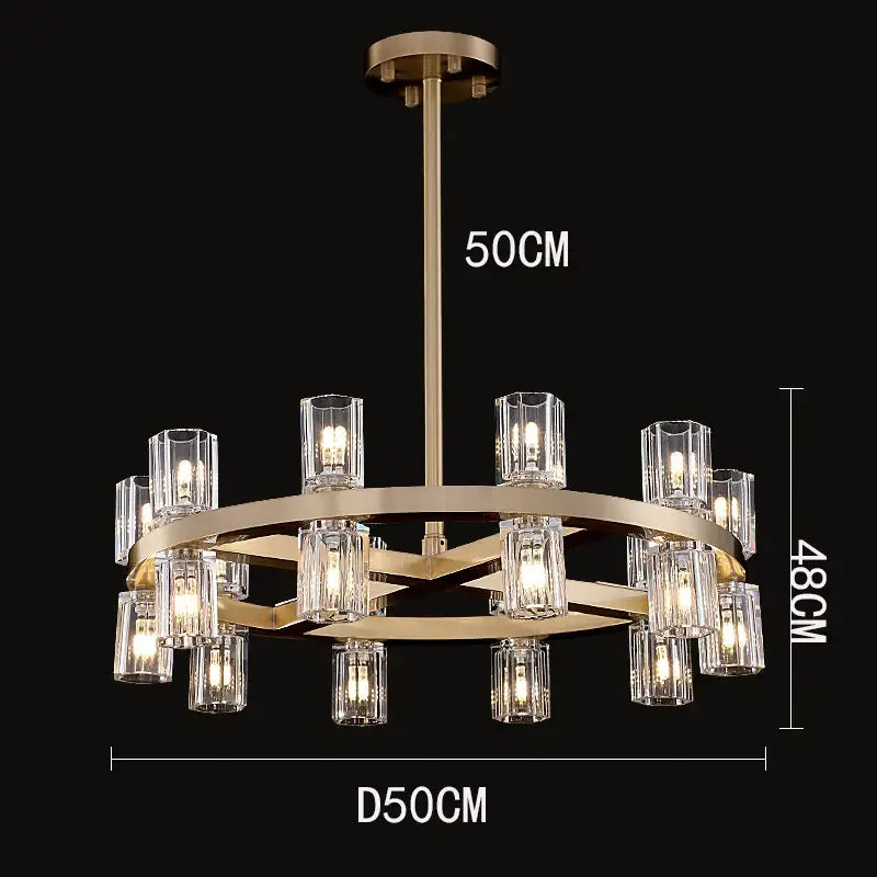 A modern brass decorbites crystal chandelier with clear glass candle style shades in a circular multi tiered design