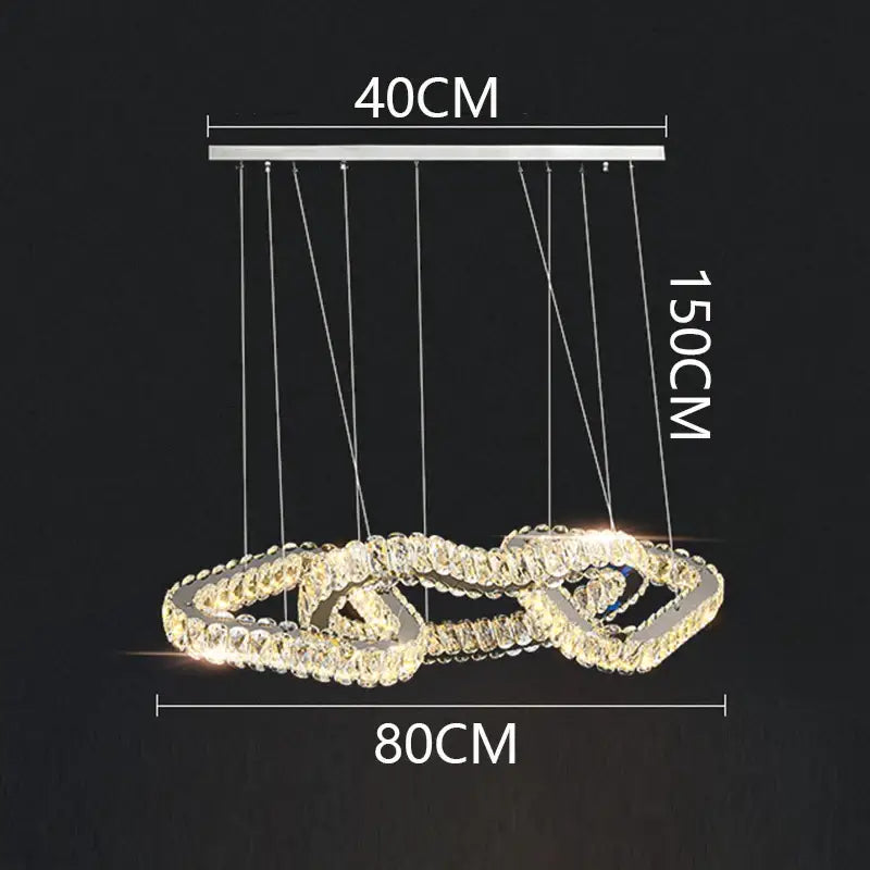 A modern double-looped decorbites crystal chandelier with chrome finish and warm led lighting for living and dining rooms
