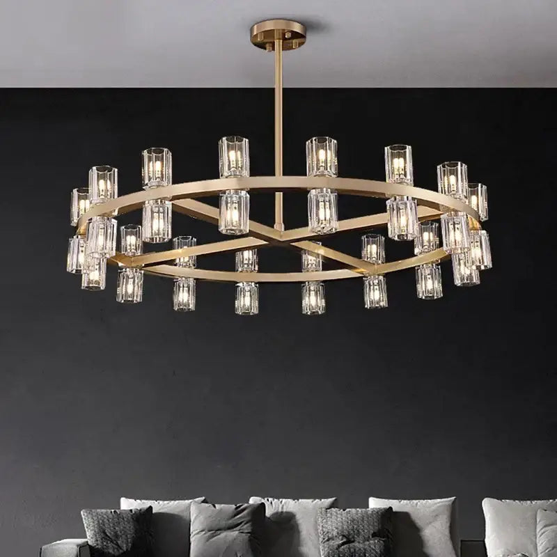Gold-toned decorbites crystal chandelier with clear glass candle bulbs in a circular geometric frame for luxury rooms