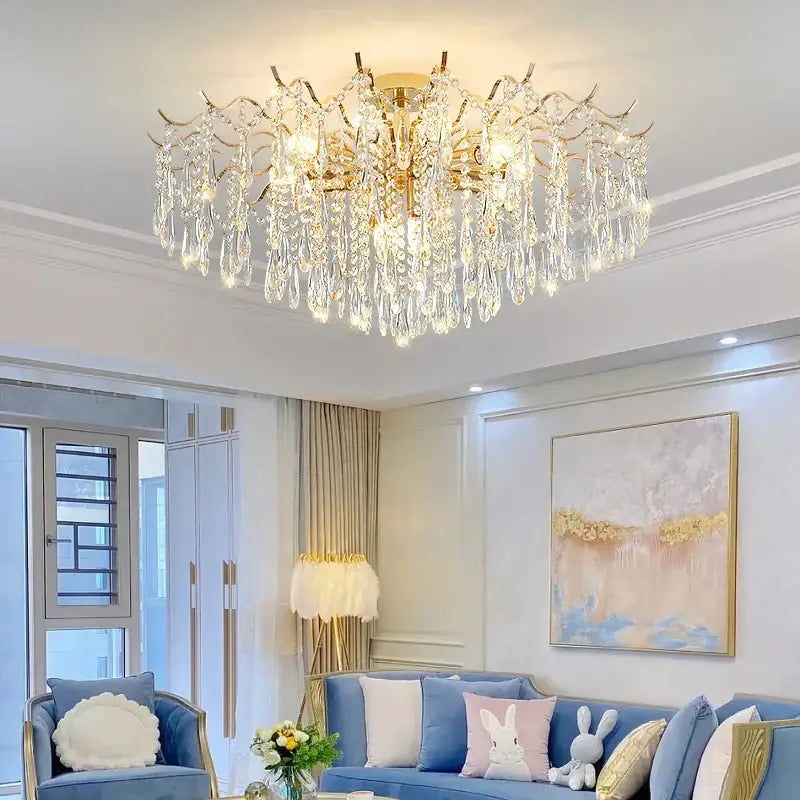 DecorBites crystal chandelier gold-toned with cascading crystal teardrops and intricate branching arms for luxury living rooms