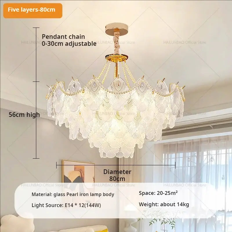 A five-layered decorbites crystal chandelier with gold-toned iron frame and white pearl glass shells for elegant lighting
