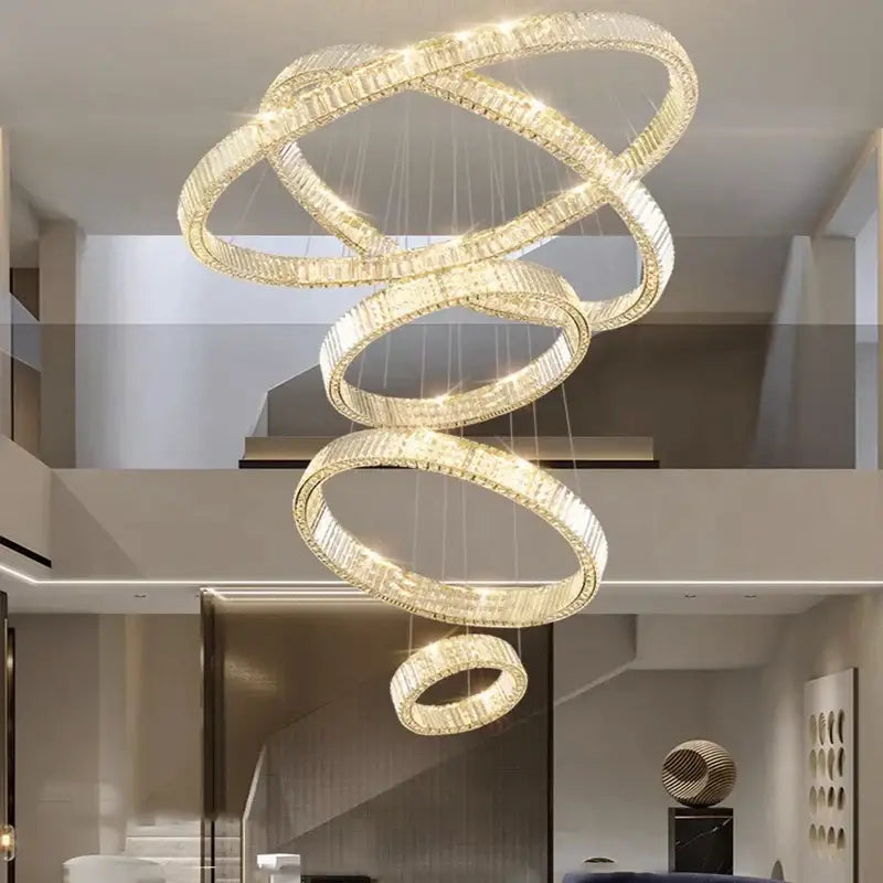 A modern decorbites crystal chandelier featuring interlocking golden rings with sparkling crystals for luxury lighting