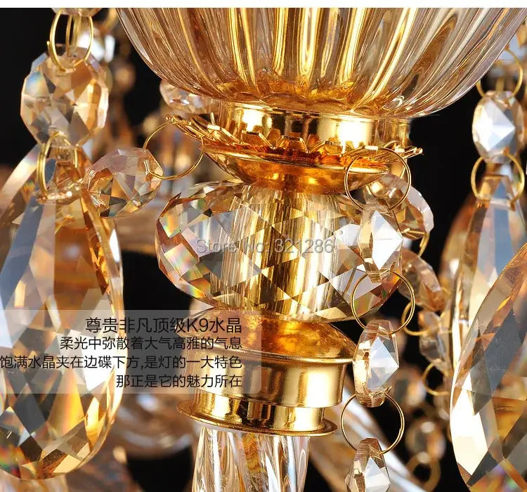 Golden decorbites crystal chandelier with faceted transparent crystals and polished brass accents for modern indoor lighting