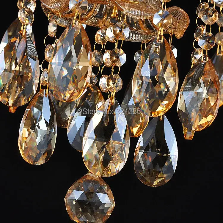 Golden teardrop-shaped decorbites crystal chandelier pendant with faceted amber and clear glass beads for indoor lighting