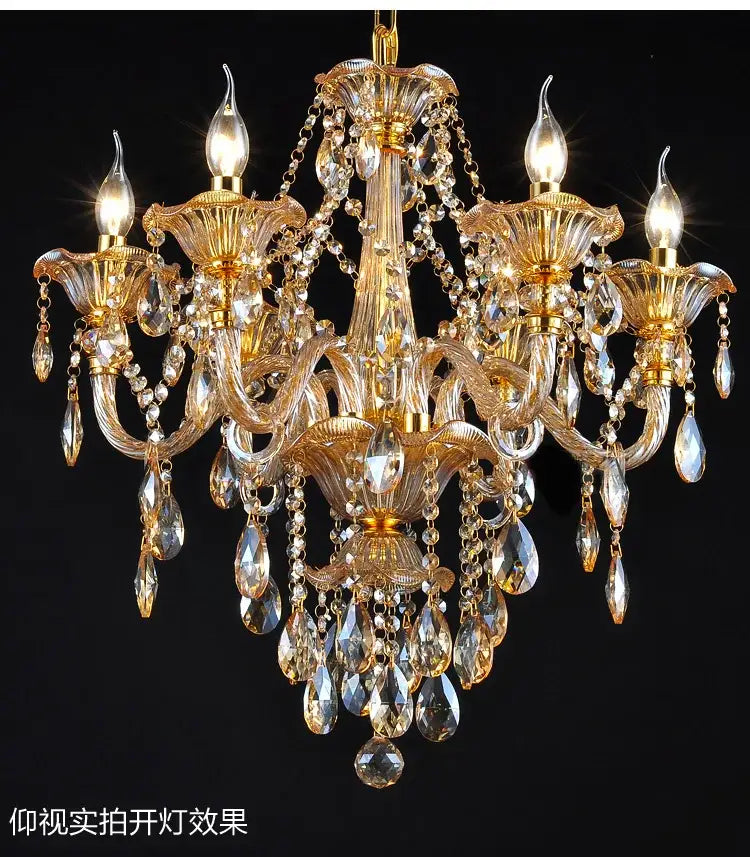 Gold-toned DecorBites crystal chandelier with intricate glass arms and dangling faceted teardrop crystals for indoor lighting