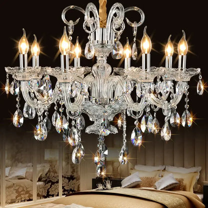 A decorbites crystal chandelier with intricate silver metalwork and teardrop crystals for luxury living room lighting