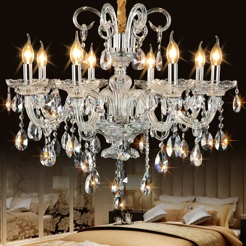 A decorbites crystal chandelier with intricate silver metalwork and teardrop crystals for luxury living room lighting